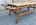 Grande table basse en bambou, fixations en rotin, plateau imitation bois clair, en excellent état de conservation. Pour ajouter une touche ethnique à votre décoration, à utiliser en table de salon ou bout de lit.