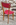 Paire chaises vintage années 50, bois massif et skaï rouge.