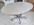 Table ovale Roche Bobois, esprit Florence Knoll, laminé blanc et chrome, années 70