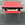 Table formica rouge de marque Tublac et ses 6 chaises assorties.