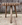 Tabouret sculptural en bois brut, tranche crantée façon roue dentée, art populaire brutaliste