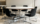 Table à manger ovale moderniste, plateau blanc & piètement étoile chromé, vintag, années 60